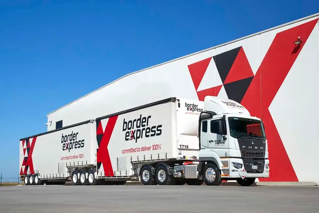 A Border Express B-double in the red and black livery HAUL designed
