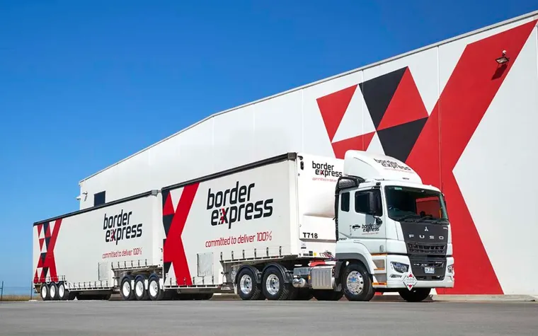 A Border Express B-double in the red and black livery HAUL designed