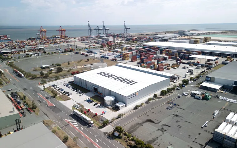 Aerial view of a logistics depot beside a container port